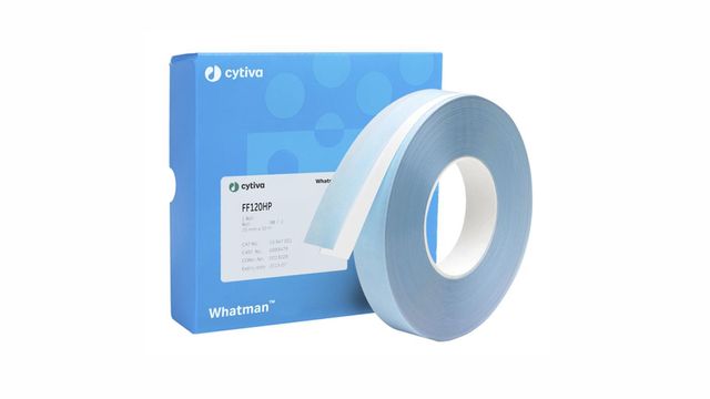 Roll of Whatman FF120HP membrane tape next to a blue Cytiva box with product label on a white background.