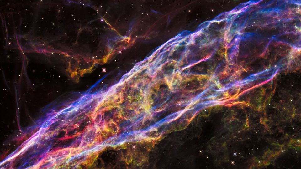 The Veil Nebula Supernova Remnant, a psychedelic spiral of colour in space.
