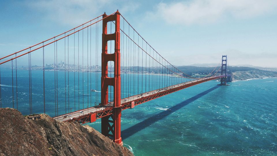 A photograph of the Golden Gate Bridge on a sunny day.