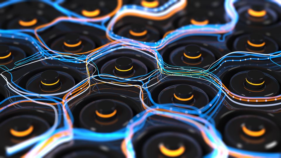 The tips of many batteries standing on their end, with blue and orange lines representing electric charge superimposed in a layer over the top of the batteries.