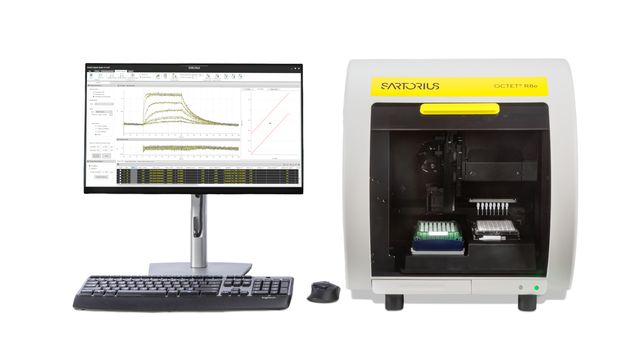Sartorius Octet R8e biosensor system with open front chamber, 96-well plates, and computer displaying binding curves 