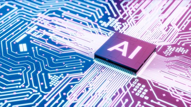 A graphic of a microchip with "AI" written on it, in a bed of blue and pink circuits.
