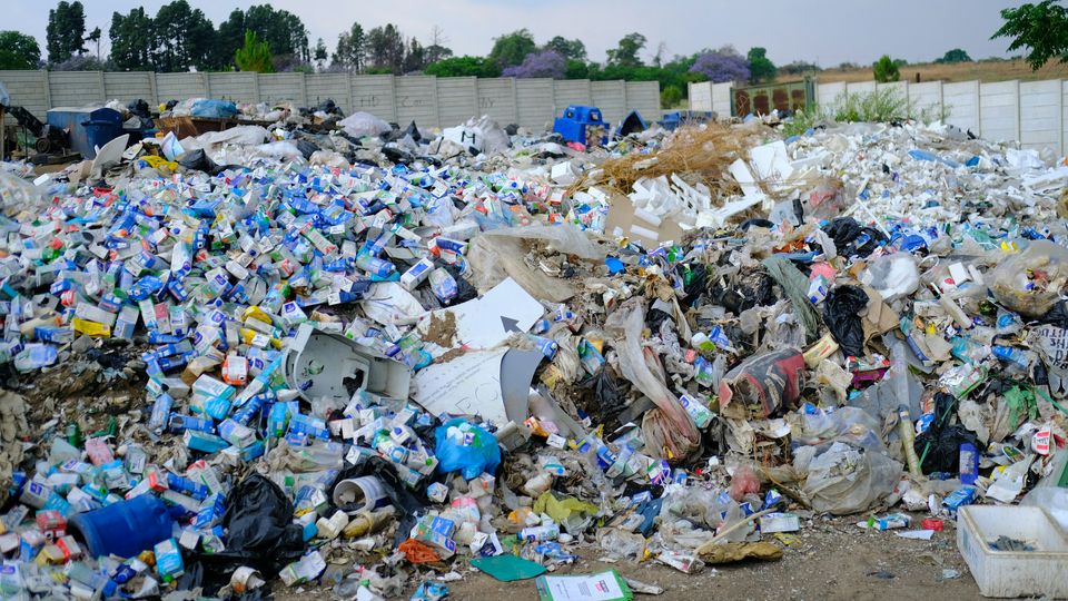 Piles of plastic waste at a dump.