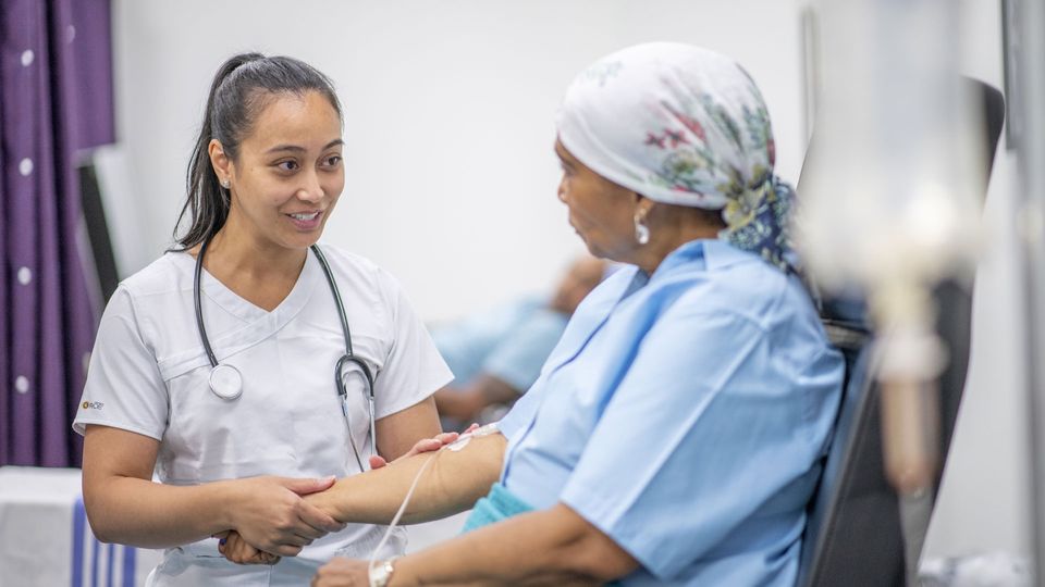 Doctor talking with cancer patient.