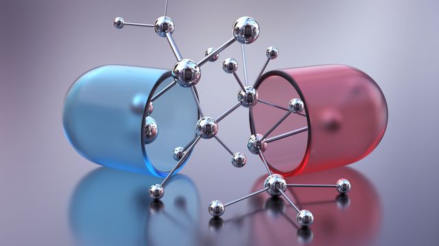 A metallic-effect molecule emerging from two halves of a split-open drug capsule.