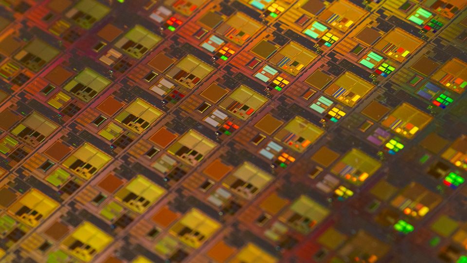 A close-up photo of patterned circuits on a semiconductor wafer.
