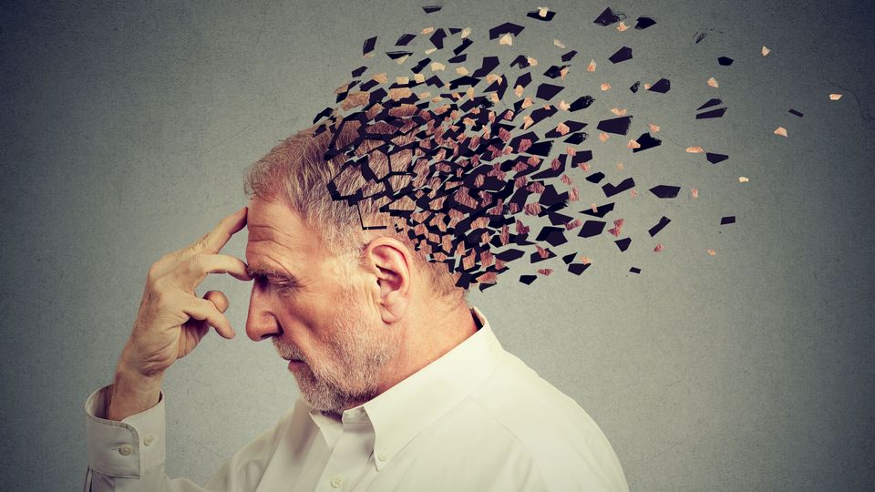 Elderly man with fragmented head symbolizing memory loss and cognitive decline in brain aging.
