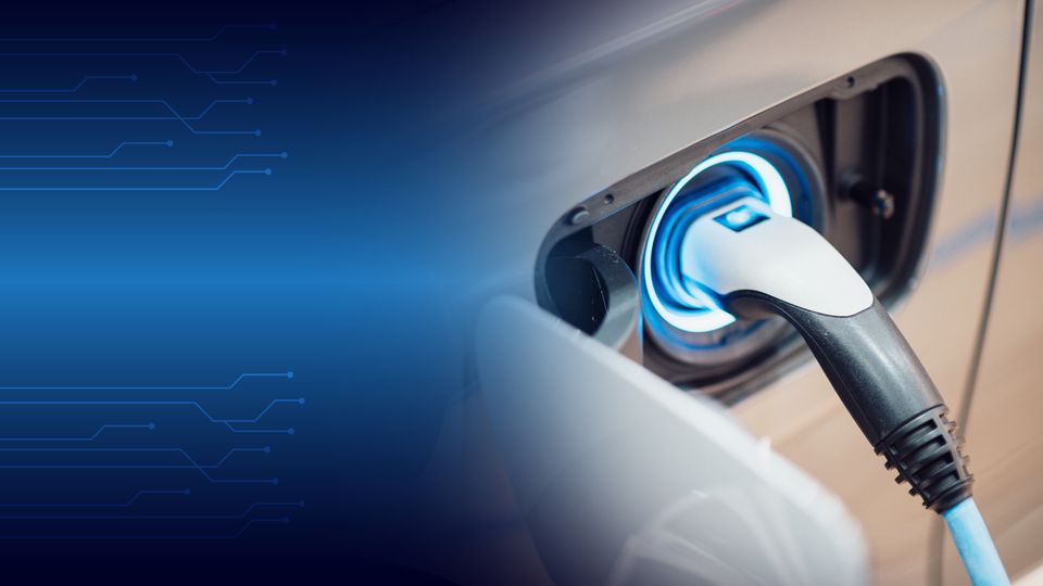 A charger plugged into an electric vehicle.