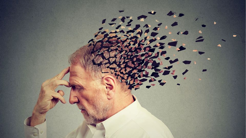 Illustration of older mans head (brain) breaking into pieces, indicating brain aging.