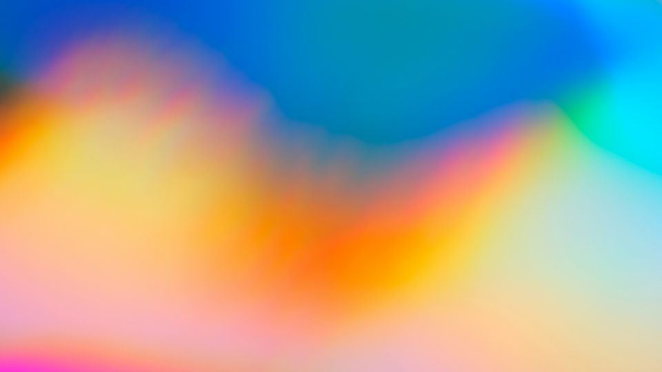 A blend of colours, blue, green, orange and purple.