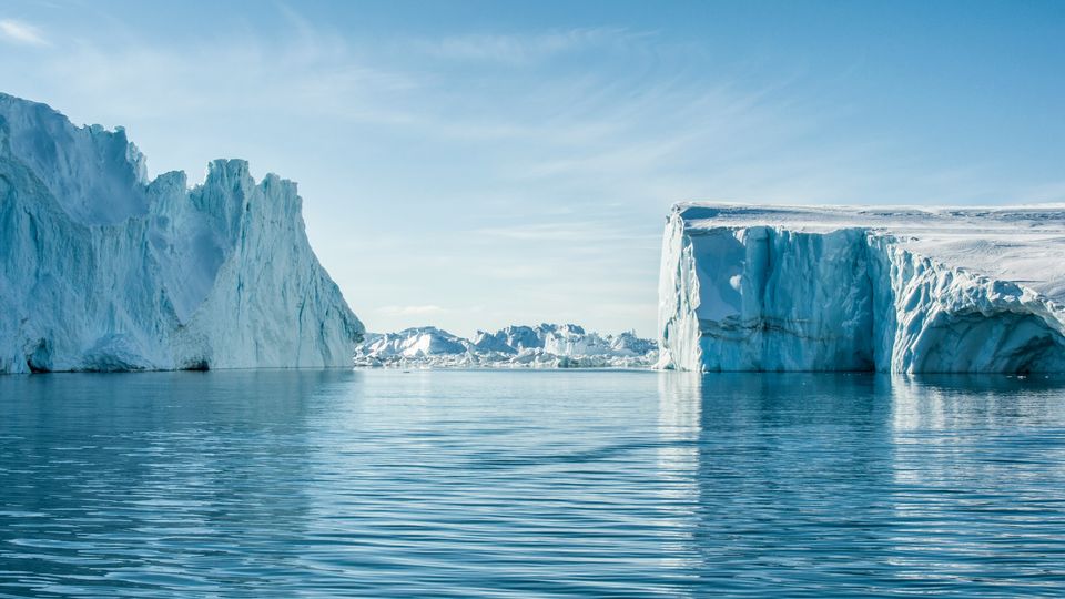 Icebergs and blue sky and sea.