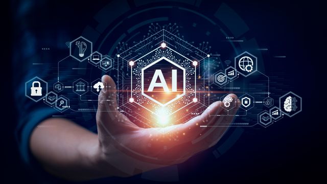 Hand holding a glowing AI symbol surrounded by futuristic digital technology icons. 
