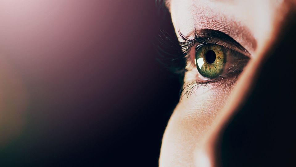 A close up of a woman's eye, which contains the metabolites agmatine and thiamine present at lower levels in glaucoma.