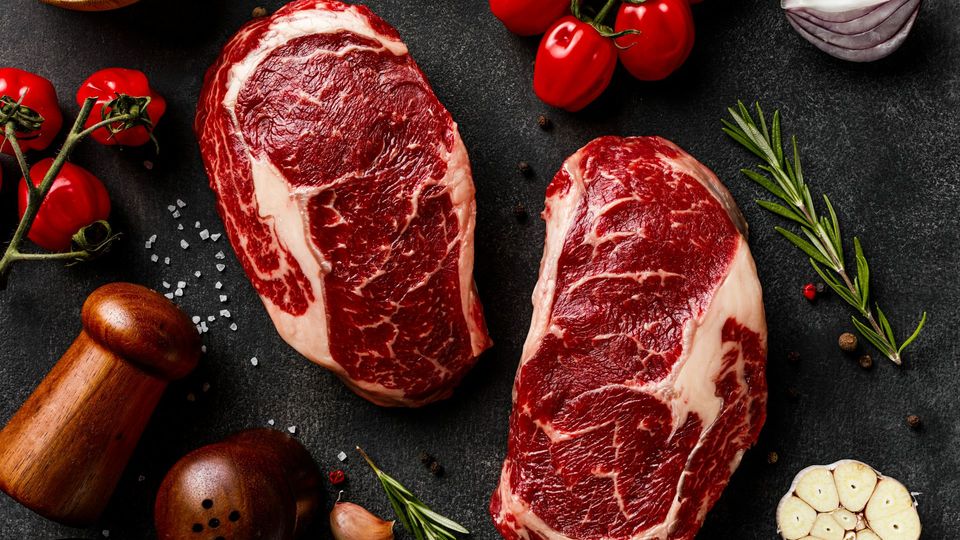 A pair of steak, symbolizing the link between red meat, gut microbes and aneurysm risk.