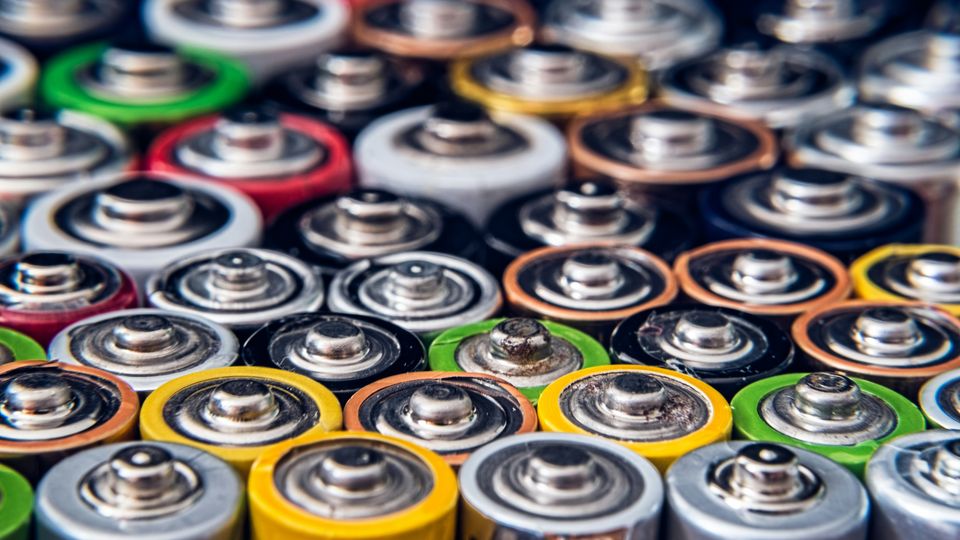 Rows of different batteries standing on their end.