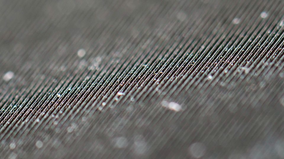 A close-up of laser-etched, nano-scale lines on the surface of a solar thermoelectric generator.
