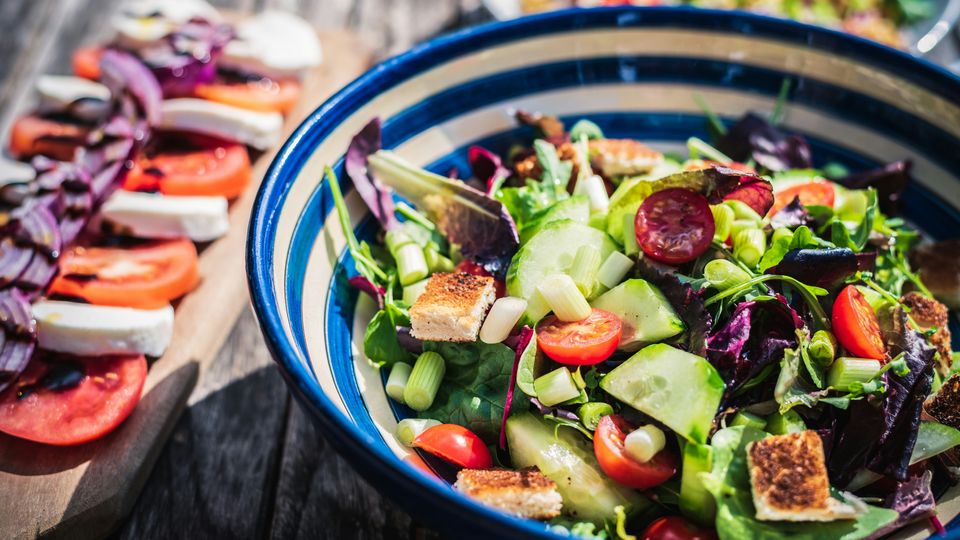 A bowl of salad. Cucumber, tomatoes, croutons, etc.