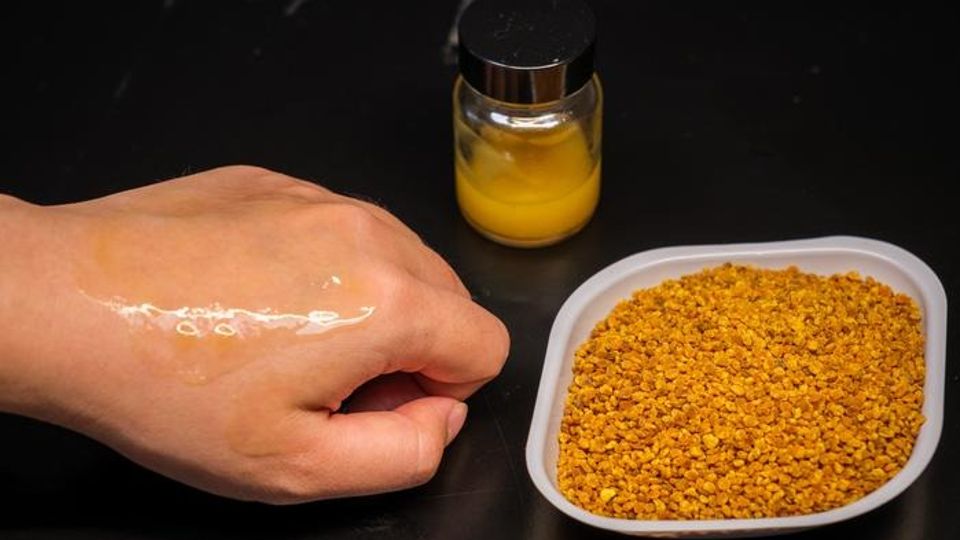 Close up of the sunscreen applied to skin (left) and the raw camelia pollen on the right.