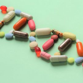 DNA double helix made of colorful pills representing pharmacogenomics and personalized medicine. 