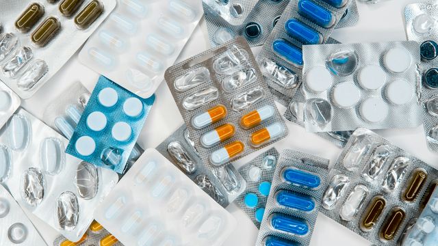 A variety of different blister packets containing drug pills and tablets. 