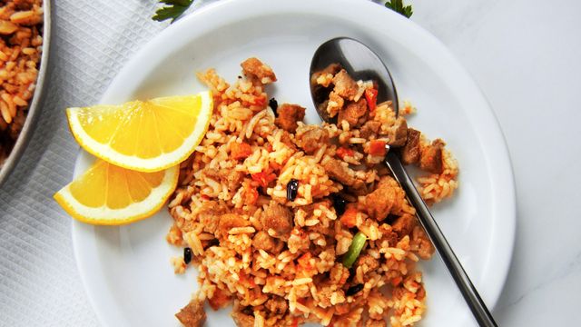 A plate of rice with a spoon in, illustrating appetite and hunger. 