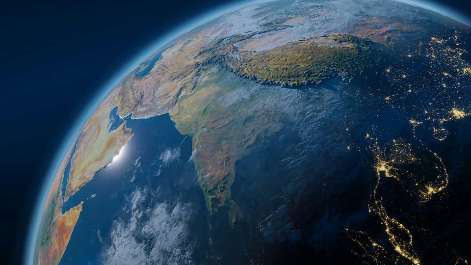 Planet Earth on the right hand side of the screen on a black background.