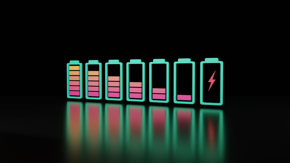 Seven rectangular batteries outlined in green on a black background, showing different charge levels indicated by red and orange bars.
