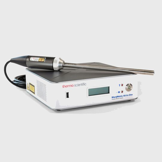 Thermo Scientific MarqMetrix All-In-One process Raman analyzer with attached probe on a white background 