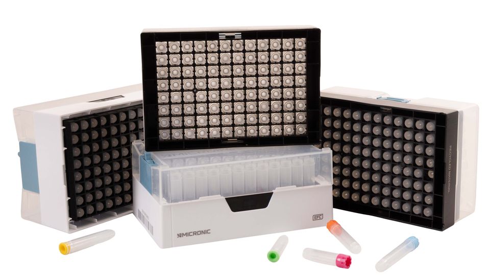 Micronic’s Non-Coded sample storage tubes displayed in racks with colored caps and open trays.