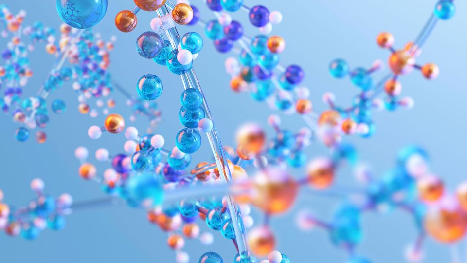 Multi-colored beads making up molecules.