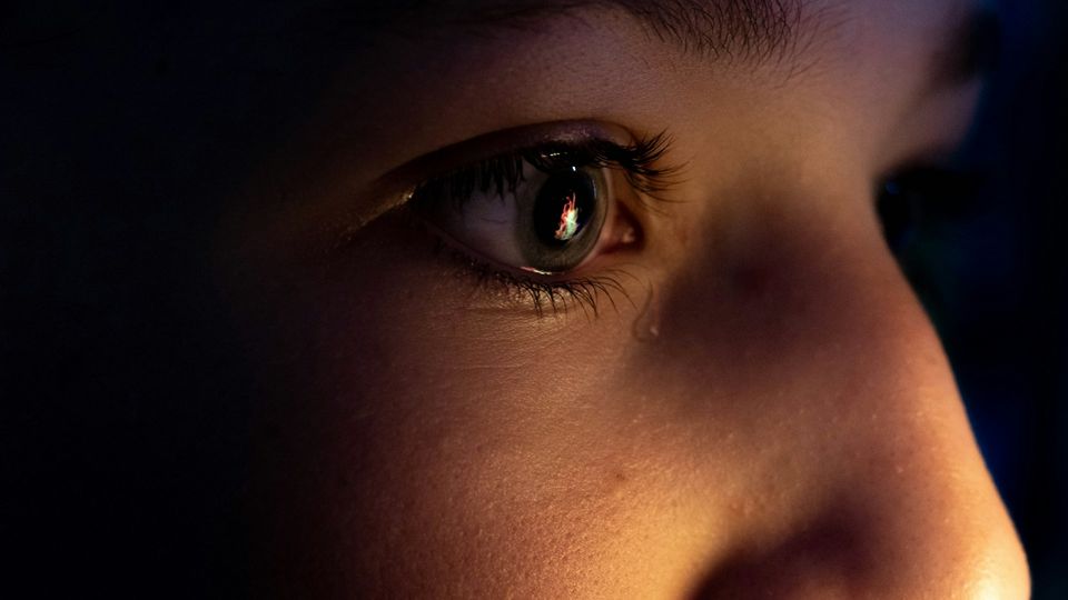 Close-up of a child’s eye with a tear, illustrating the potential of tears as biomarkers.