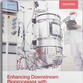 Scientist in protective gear monitoring stainless steel bioprocess equipment to enhance downstream bioprocesses with Raman spectroscopy