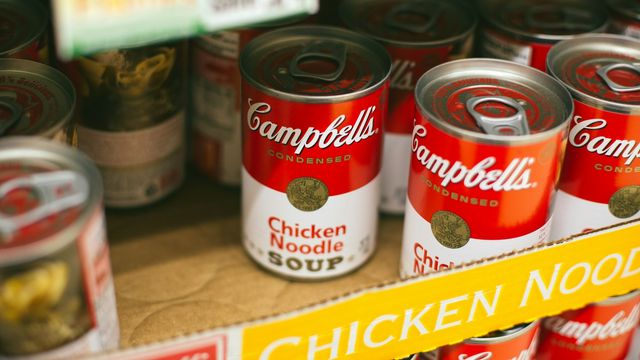 Cans of Campbell’s Chicken Noodle Soup displayed on a store shelf. Many food cans are lined with materials that may contain Bisphenol A (BPA), a chemical of concern due to its potential endocrine-disrupting effects. 