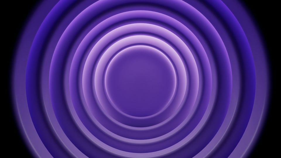A digital render of concentric purple circles emanating out against a black background, like ripples on a liquid surface. 