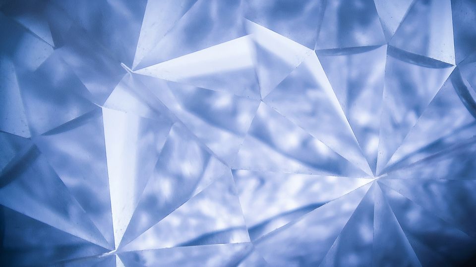 A kaleidoscope-like pattern showing the many facets of diamond. 