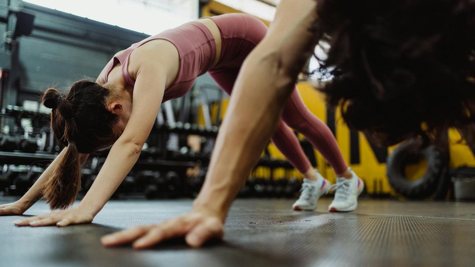 People performing high-intensity interval training, illustrating its ability to improve fitness and endurance in inflammatory muscle disease.