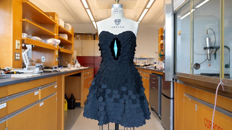A dress which uses a mix of different black fabrics. The new "ultrablack" is shown grouped around a bright blue triangle in the centre of the dress.