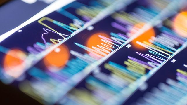 A close-up view of a digital display showing genome sequencing data. 