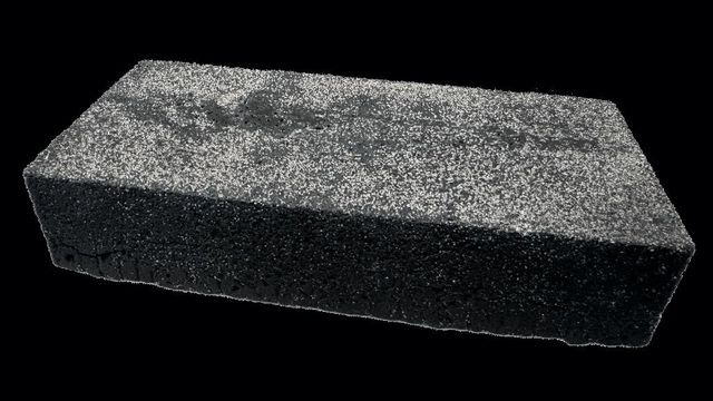 A large block of the enzymatic structural material (ESM). It looks very similar to rough concrete. 