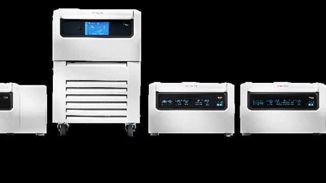 Row of laboratory centrifuges with digital displays used for sample separation workflows. 