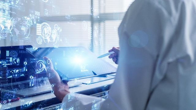Scientist reviewing laboratory data on a secure digital interface, reflecting ISO 27001 certification. 