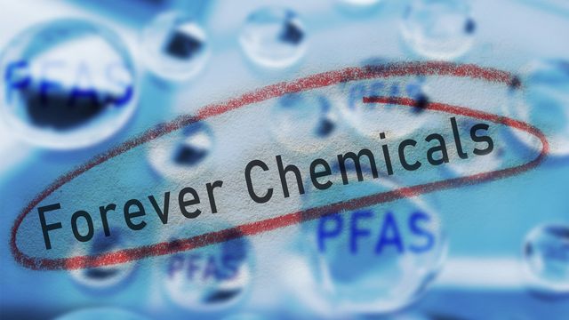 Conceptual image illustrating PFAS as "Forever Chemicals," with the phrase circled in red and the acronym "PFAS" appearing multiple times in water droplet-like spheres. 