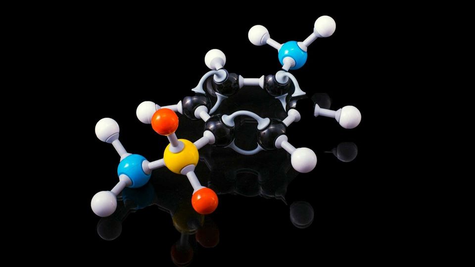 3D molecular structure model on a black background.