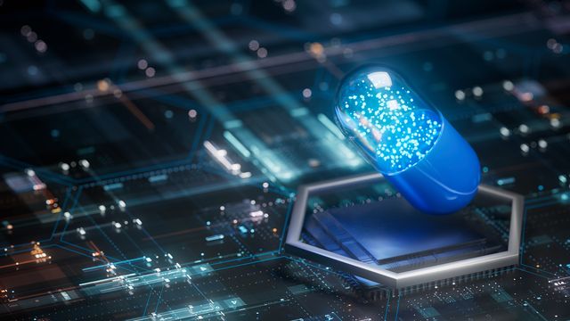 A drug capsule against a computer chip background, symbolizing machine learning in drug discovery.  