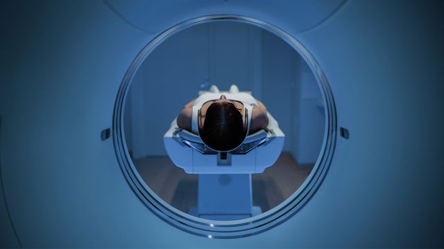 Patient undergoing a PET/CT scan for immune imaging in a clinical setting. 