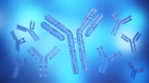 3D render of blue Y-shaped antibodies floating against a soft blue gradient background.