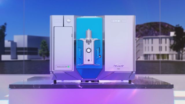 SCIEX 7500+ mass spectrometer on lab bench with purple lighting and cityscape backdrop 