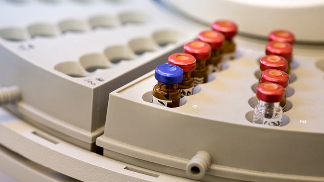 Sample vials arranged in an autosampler tray for mass spectrometry analysis. 