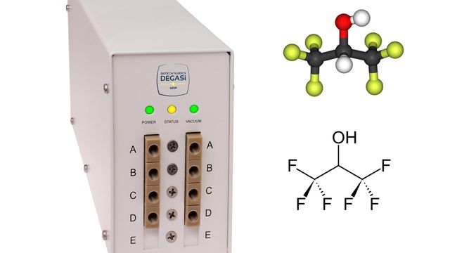 Laboratory degasser unit with molecular structure diagram used in chemical analysis. 
