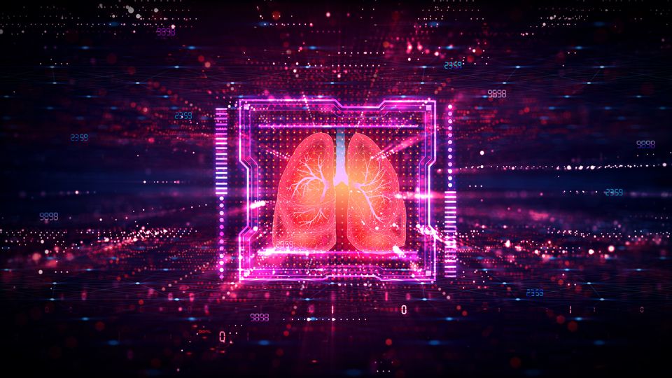 Illustration of human lungs inside a computer chip. The lungs are red and are on a black background surrounded by red and blue dots.